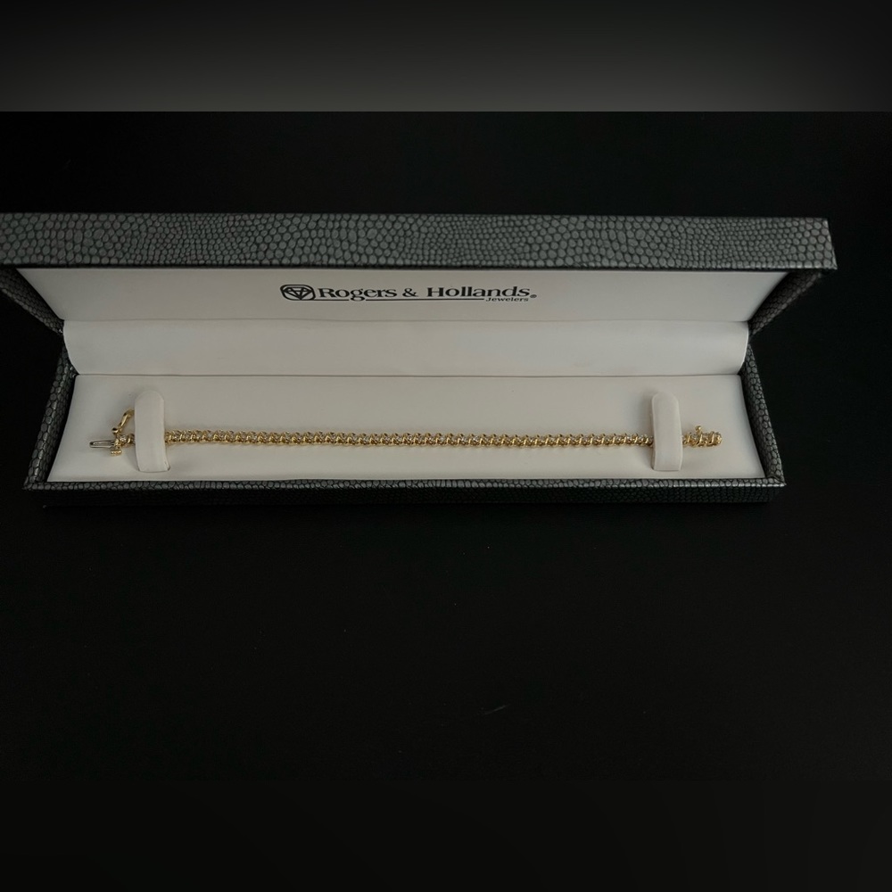 1ct Diamond Swirl 14k Yellow Gold Tennis bracelet.